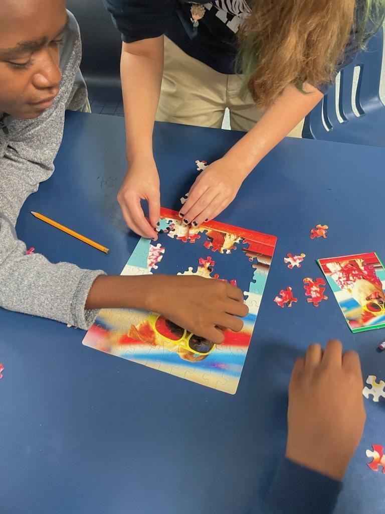 Students working on a puzzle