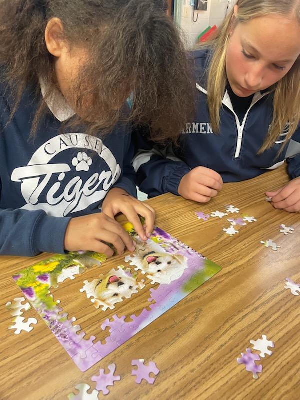 Students working on a puzzle