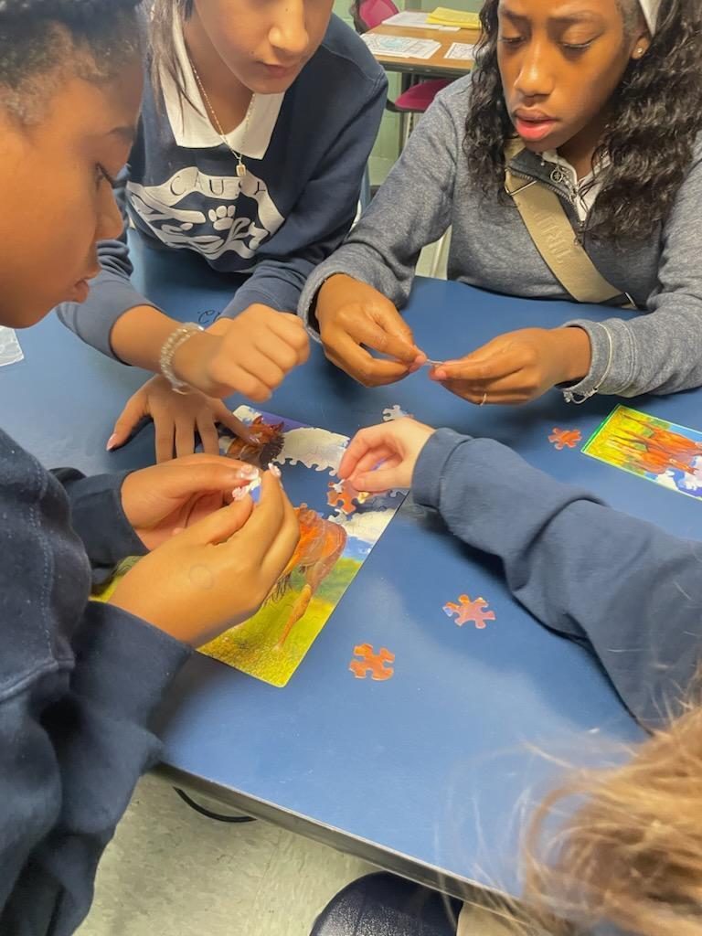 Students working on a puzzle together