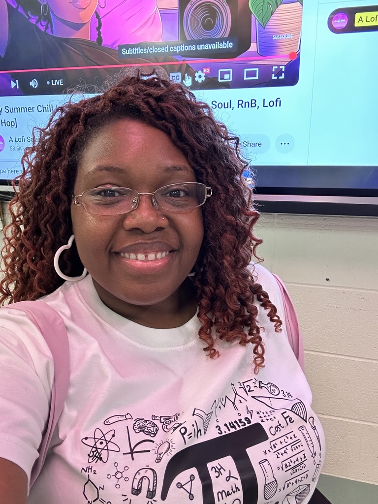 Selfie of woman in front of a screen