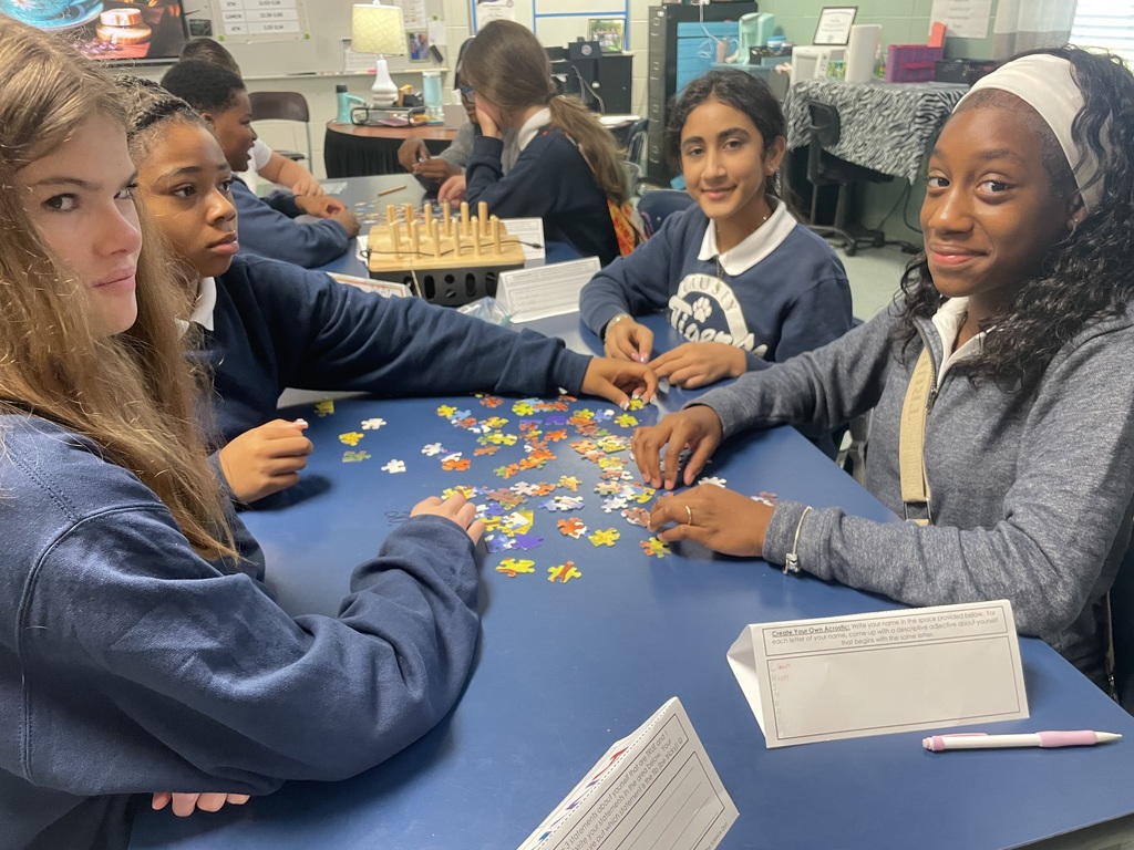Group of students working on a puzzle