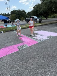 Next door neighbors painting their spots!