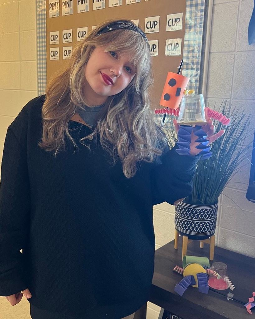 Student with a robot they created.