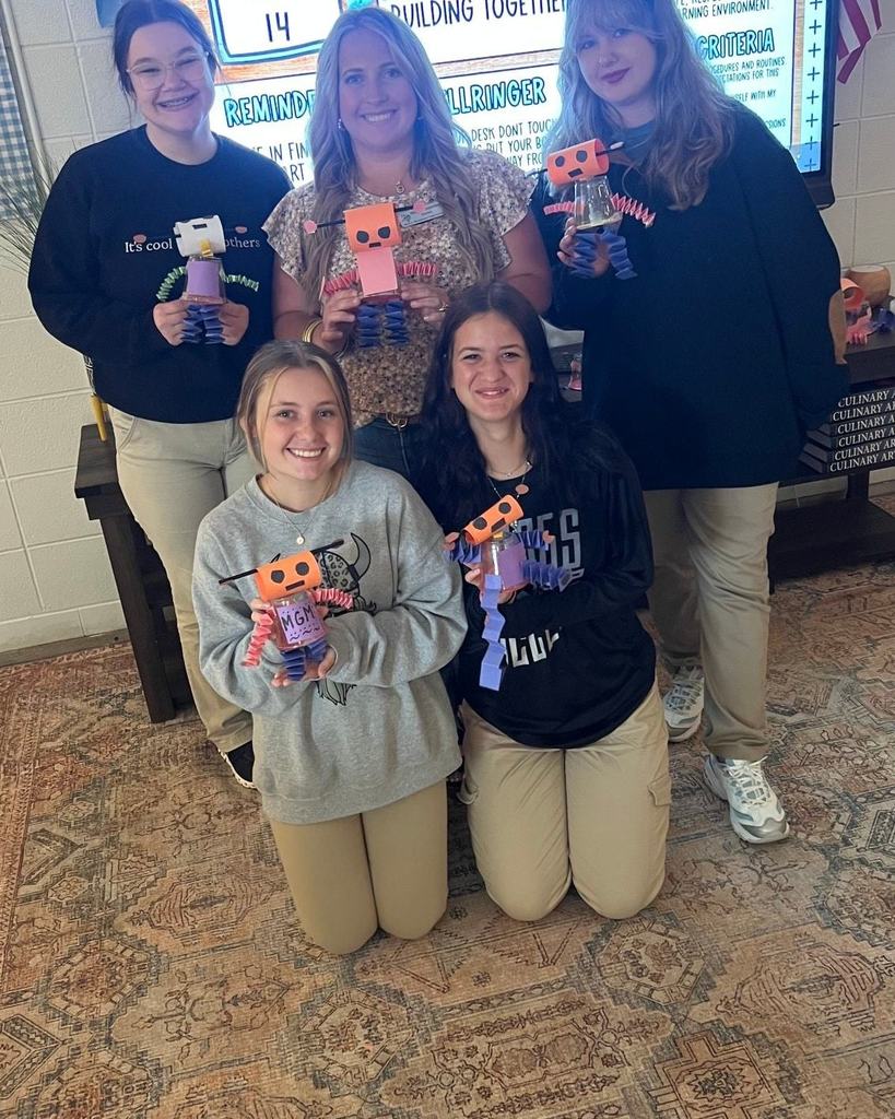 Students with robots they created.