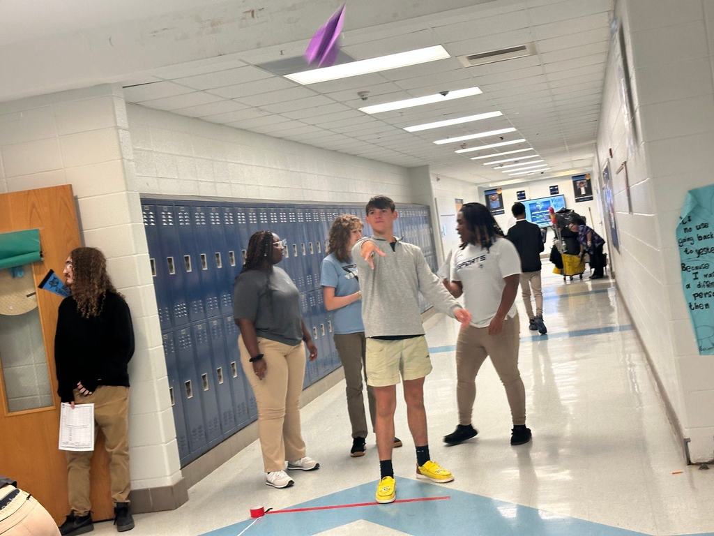 Students participating in a Paper Air Plane Lab.