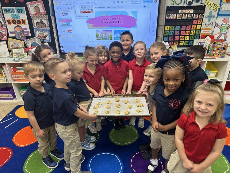mrs. Tawzer’s kindergarteners gathered around a tray of cookies