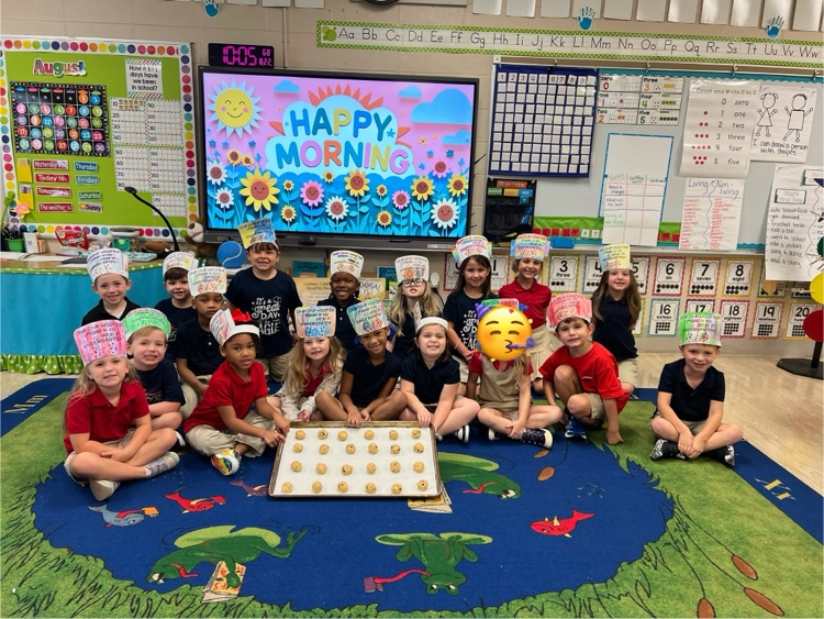 Mrs. masons class with a pan of cookies