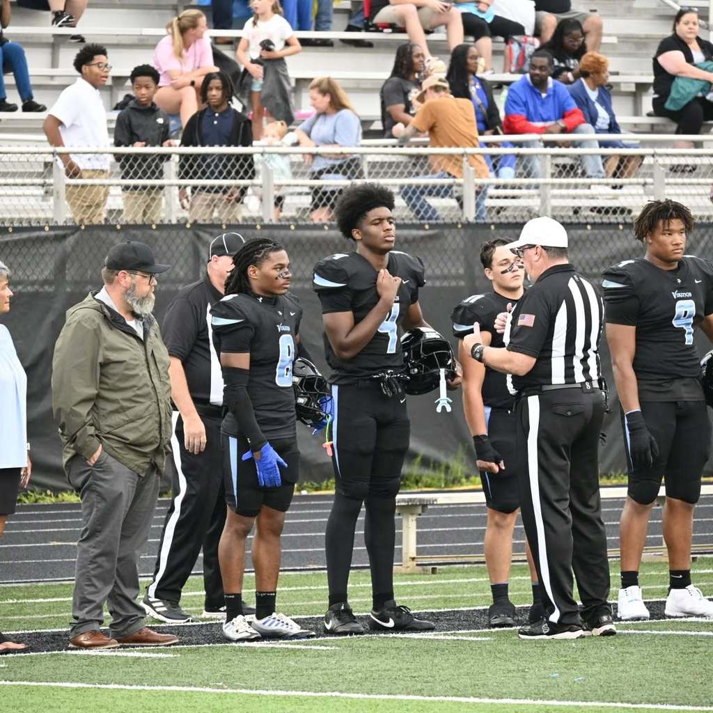 MGM Football players at the beginning of the game.