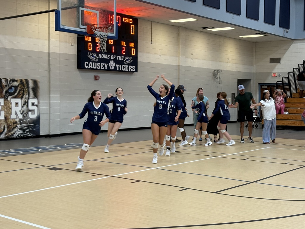 Volleyball team celebrating victory