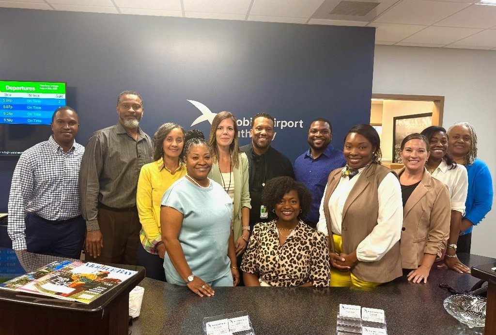 A group photo of MCPSS Career Coaches, taken at the Mobile Airport Authority