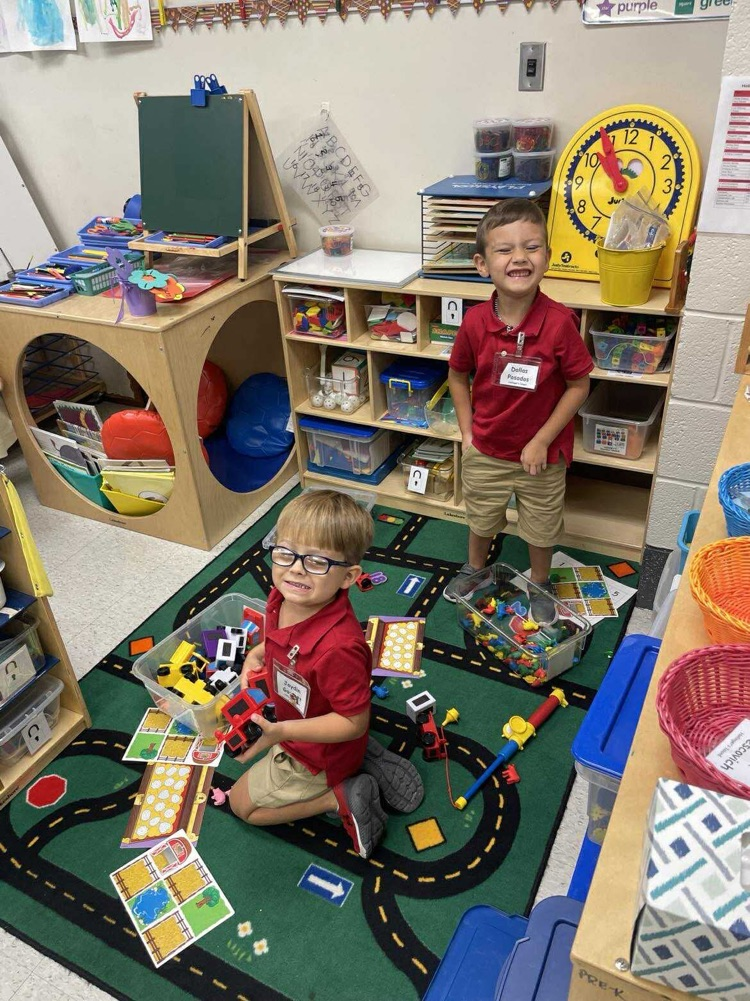 Pre K student working/playing in a center