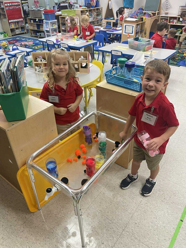 Pre K student working/playing in a center