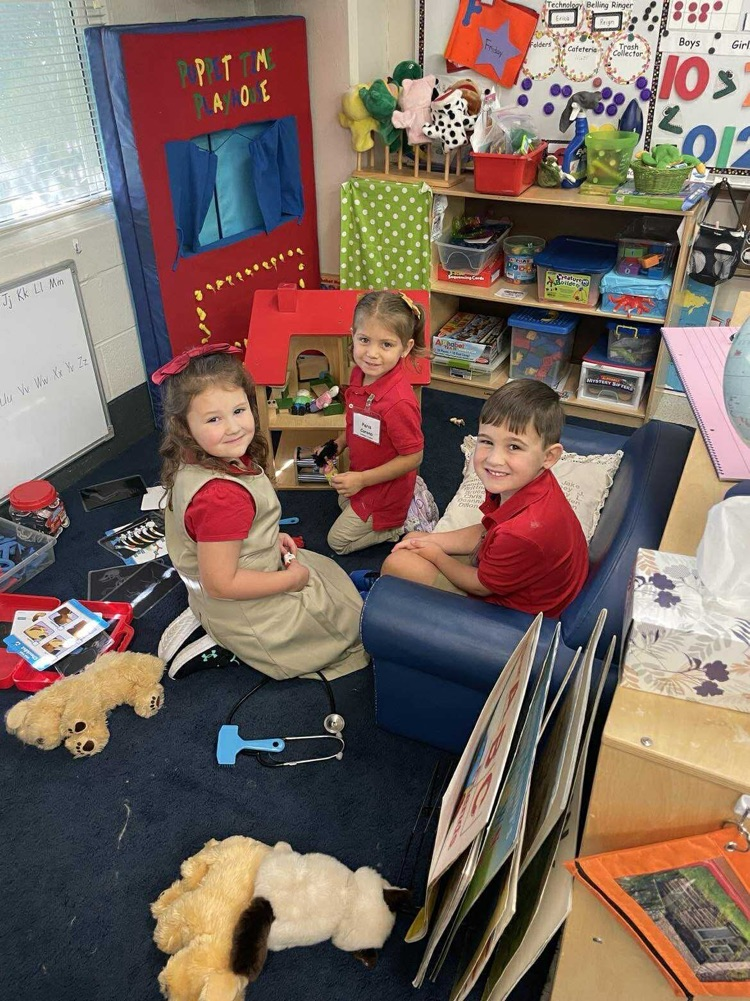 Pre K student working/playing in a center