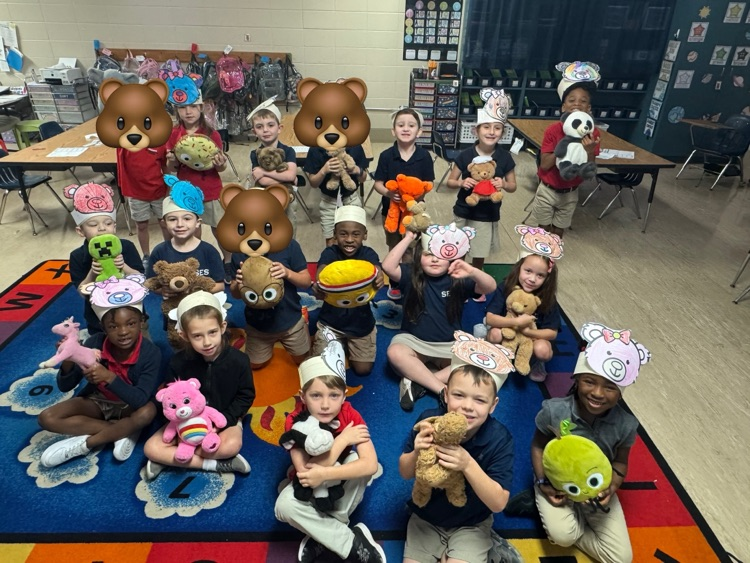 class of students holding teddy bears
