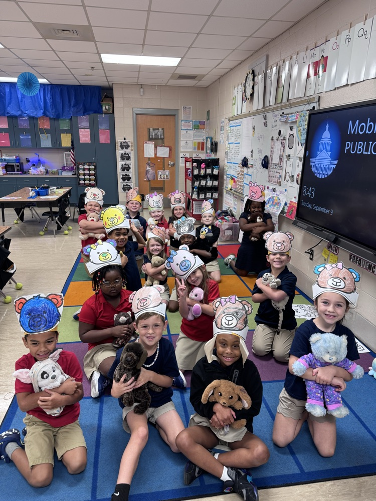 class of students holding teddy bears