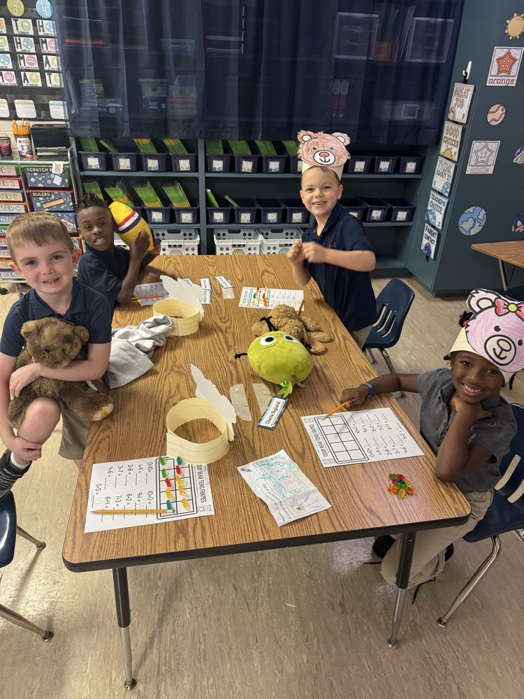 class of students holding teddy bears
