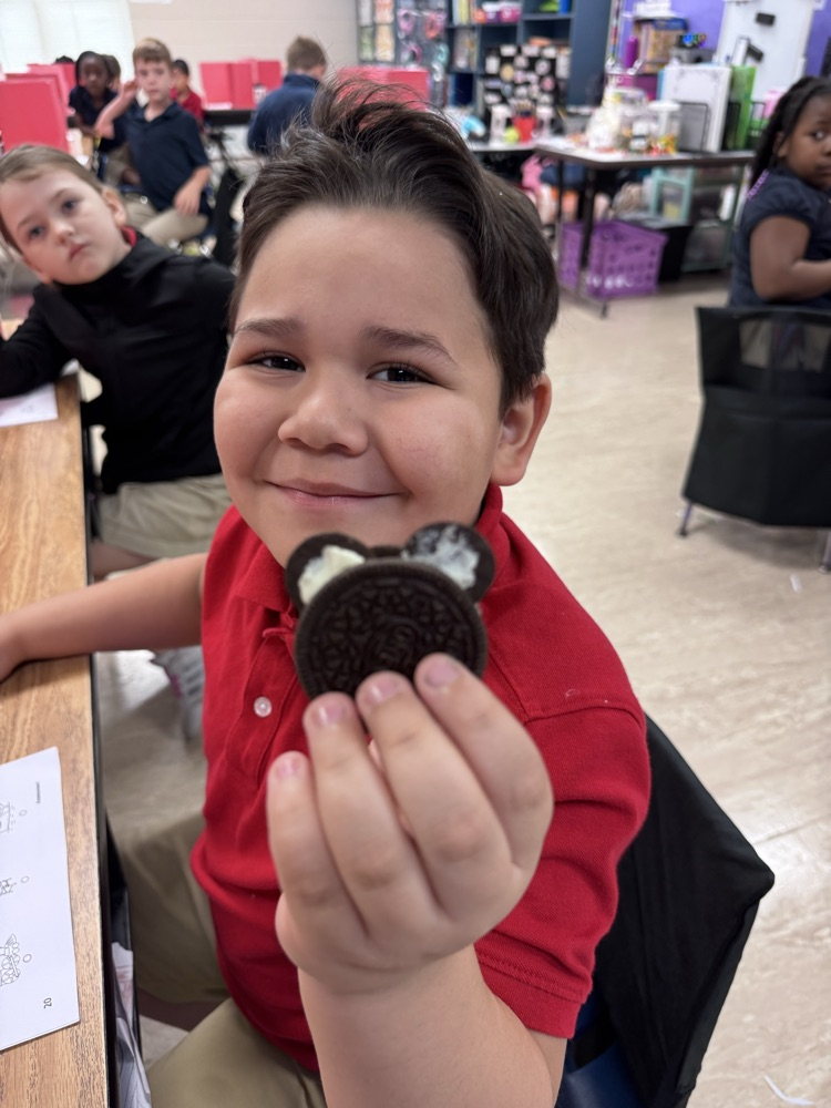 student holding Oreo 