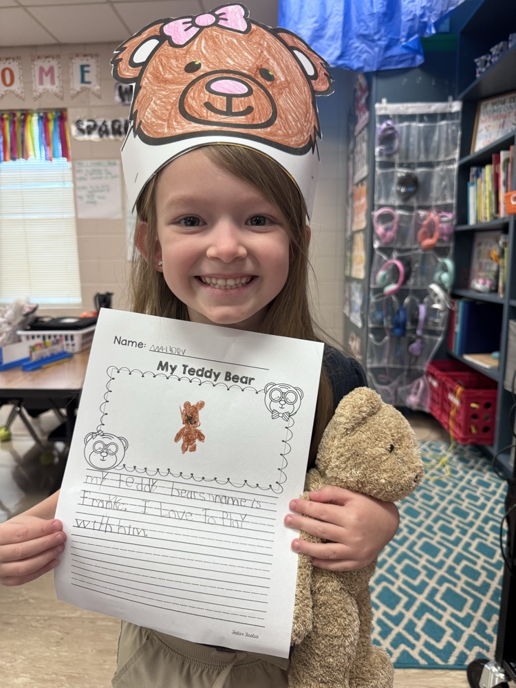 kid holding writing 