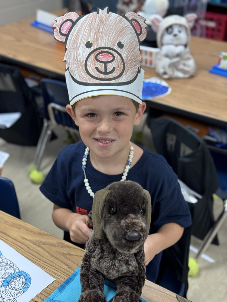 student with dog stuffed animal