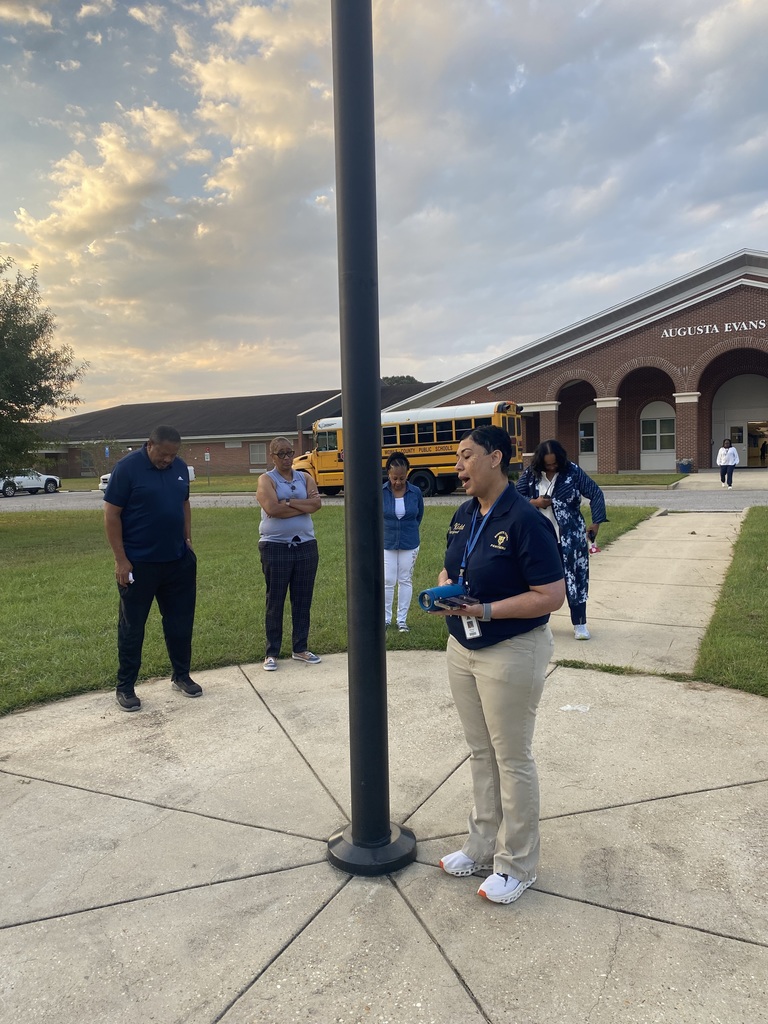Mrs. Kidd around the flagpole 