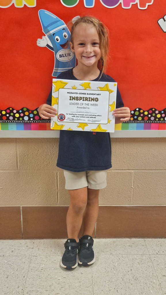 Mrs. Summersell's student holding a certificate.