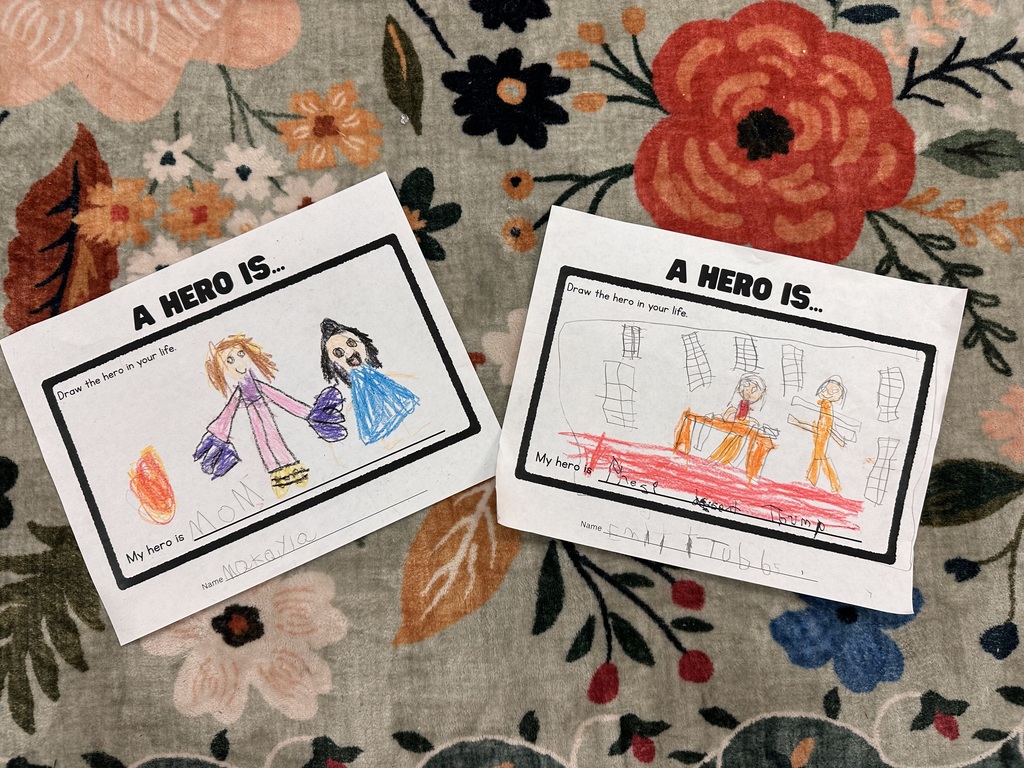 Student writing and illustrations. A hero is...