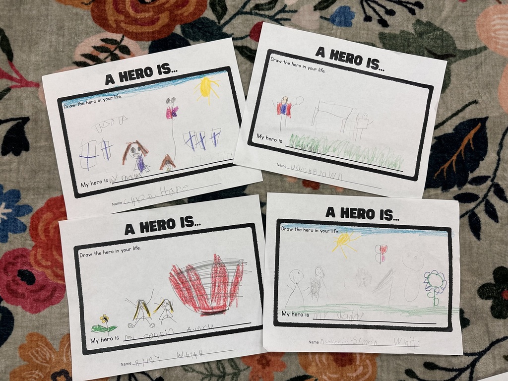 Student writing and illustrations. A hero is...