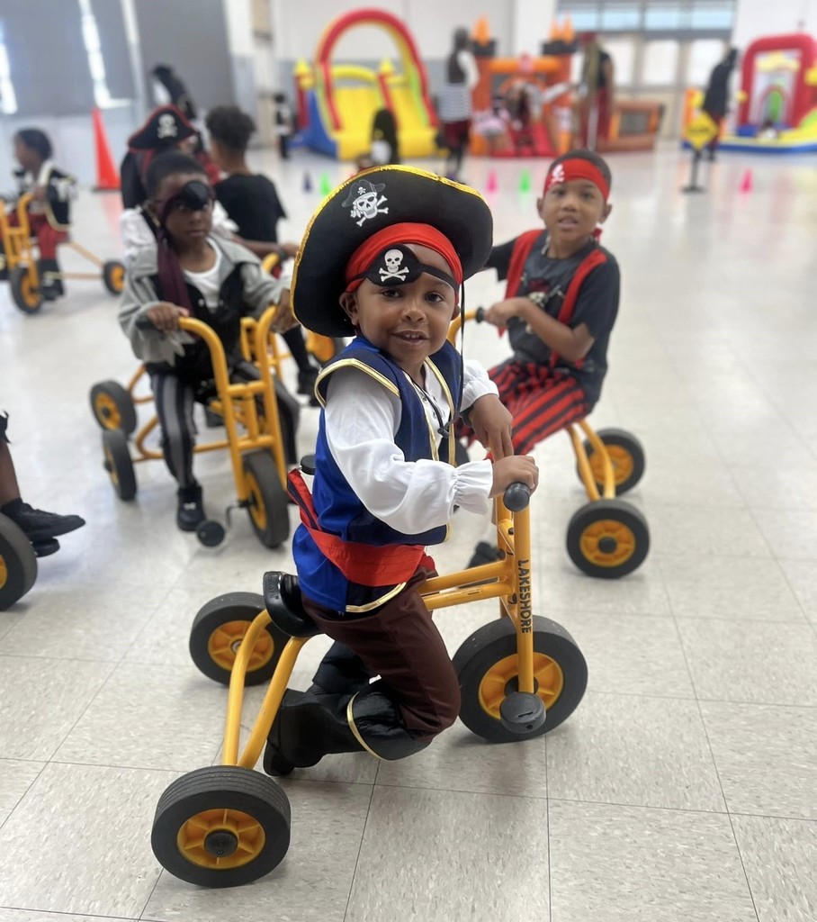 Pre-K students on tricycles, dressed like pirates