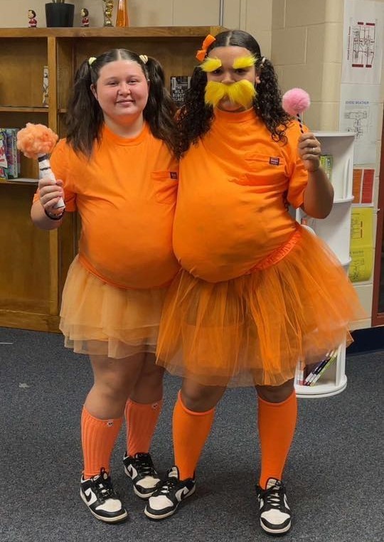 Two students dressed as the Lorax from Dr. Seuss