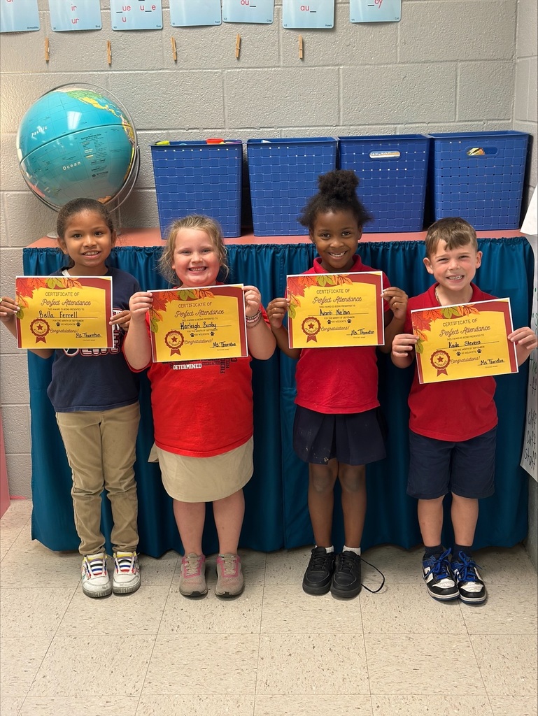 Students holding award