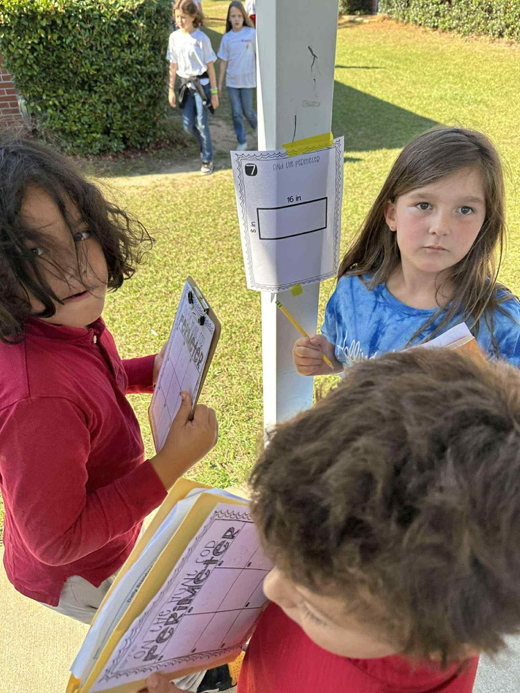 students doing math problems outside