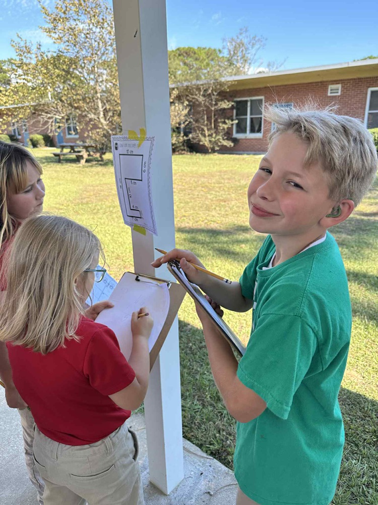 students doing math problems outside
