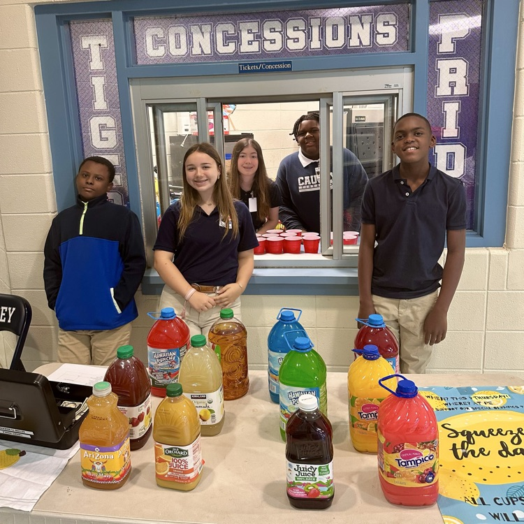 Group of students at a table with juice