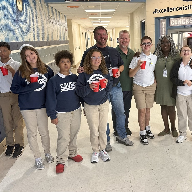 Group of students holding juice