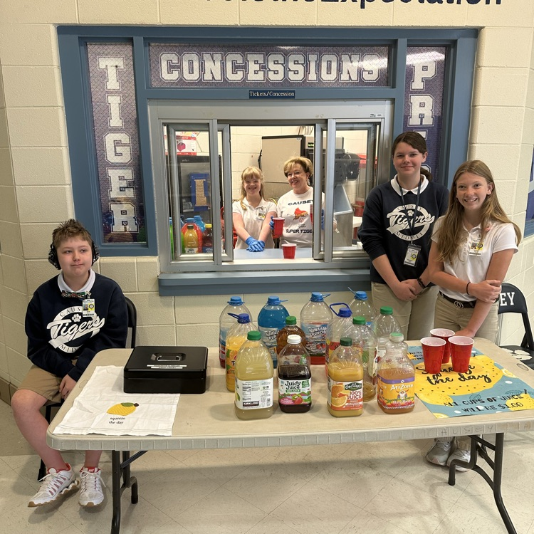 Group of students at a table with juice