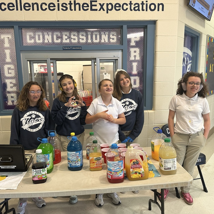 Group of students at a table with juice
