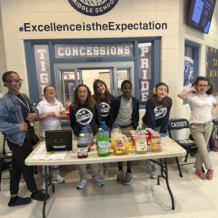 Group of students at a table with juice