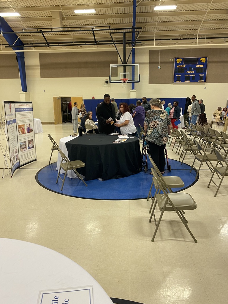 Parents walking around vendor tables