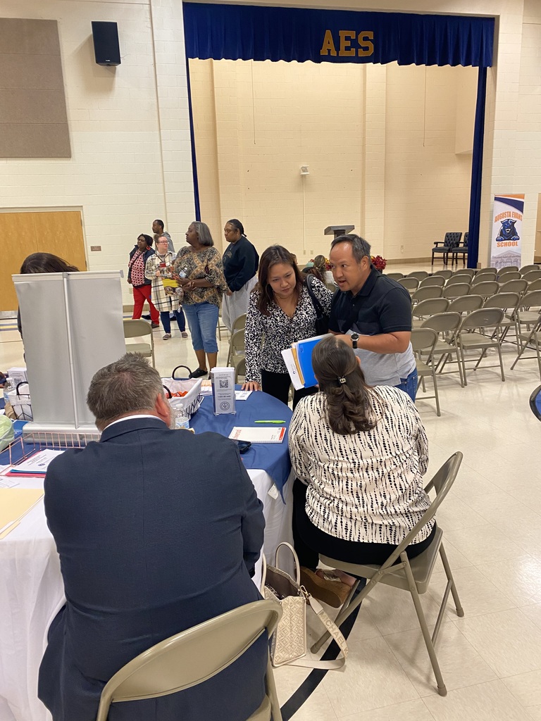 Parents discussing  with vendors 