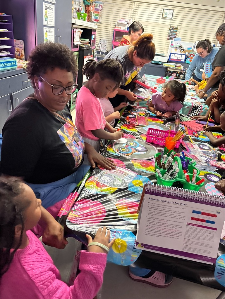 Students and parent play math games together.