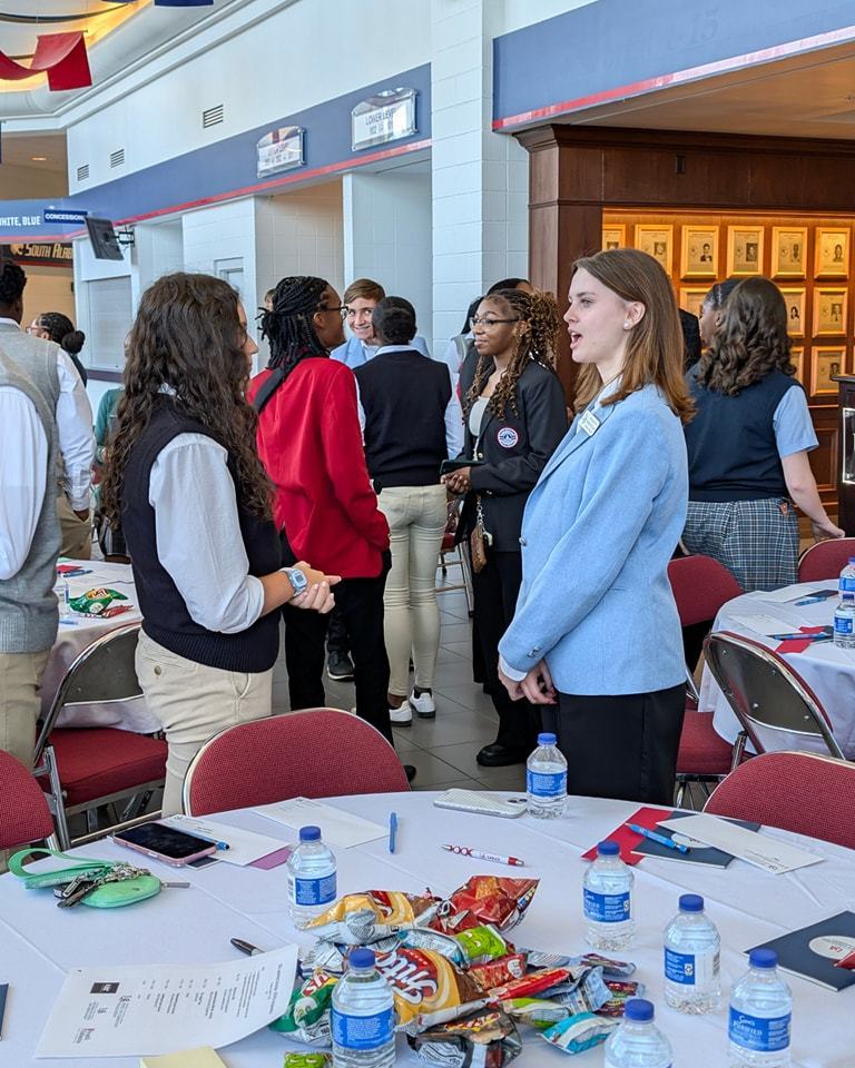 MGM Academy Ambassador speaking with an Ambassador from another school.