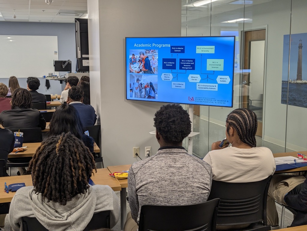 MGM seniors listening to a presentation