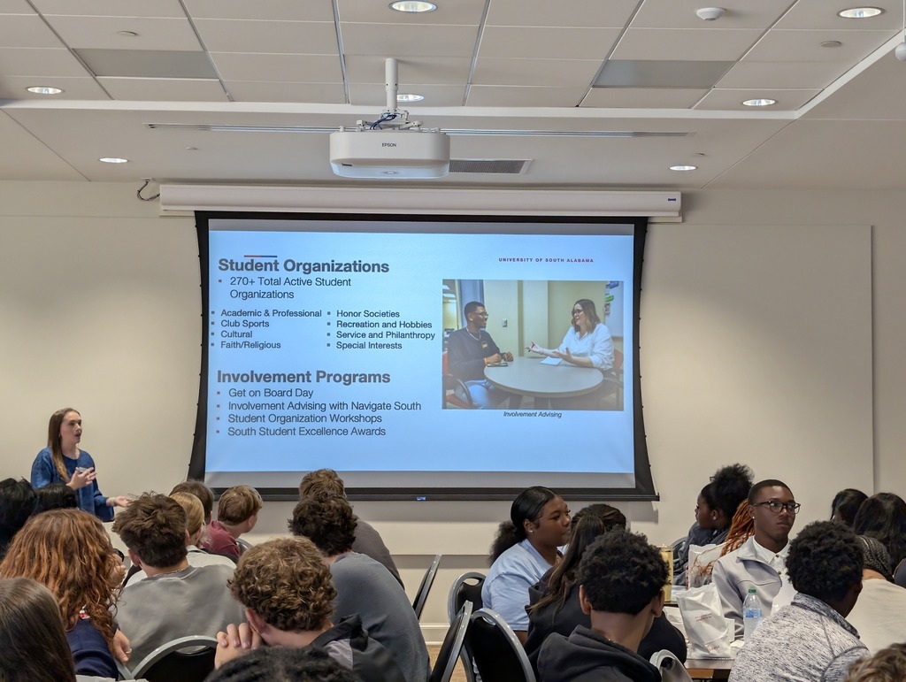 MGM seniors listening to a presentation