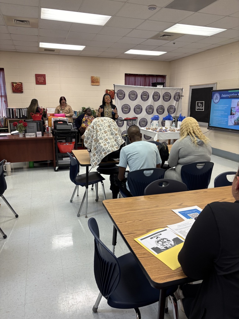 Parents sitting in attendance to a speaker