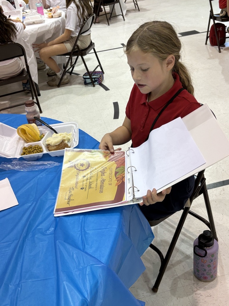 Student sharing LIM Binder with a community leader.