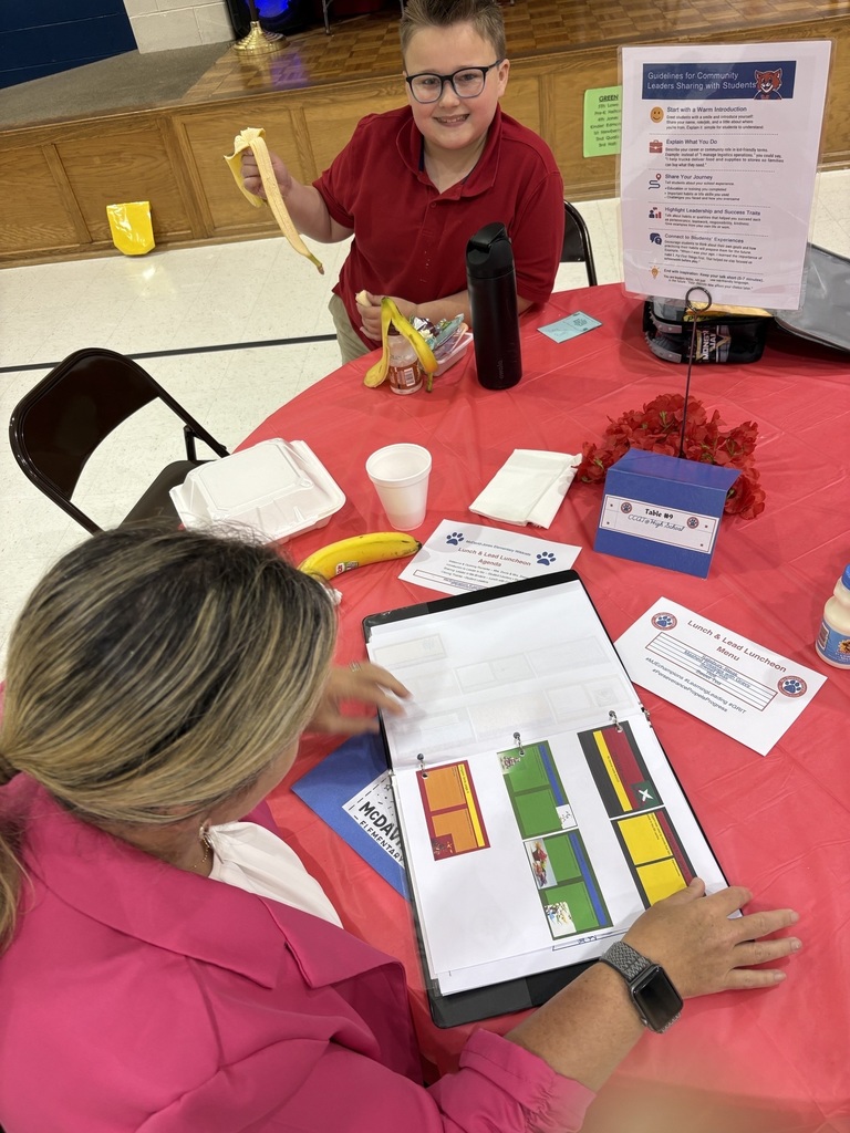 Student sharing LIM Binder with a community leader.