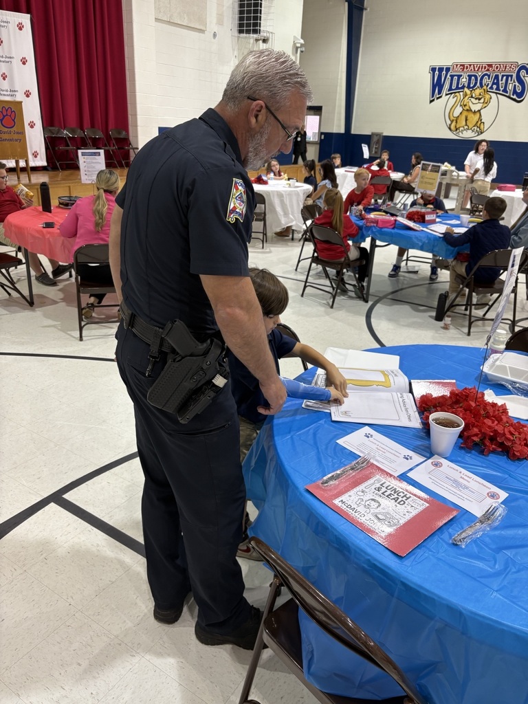 Student sharing LIM Binder with a community leader.