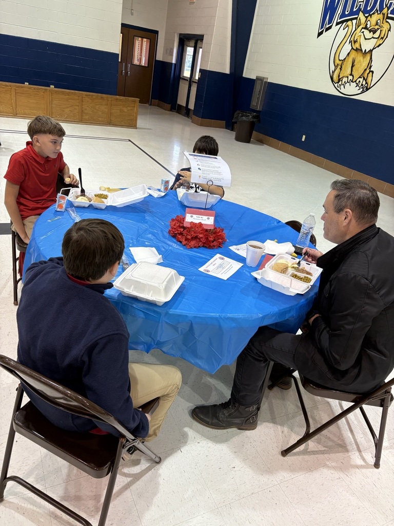 Student sharing LIM Binder with a community leader.