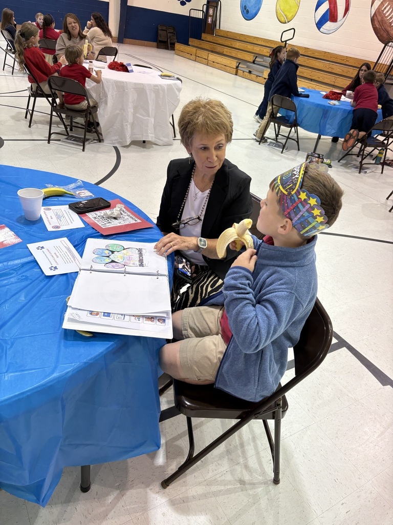 Student sharing LIM Binder with a community leader.