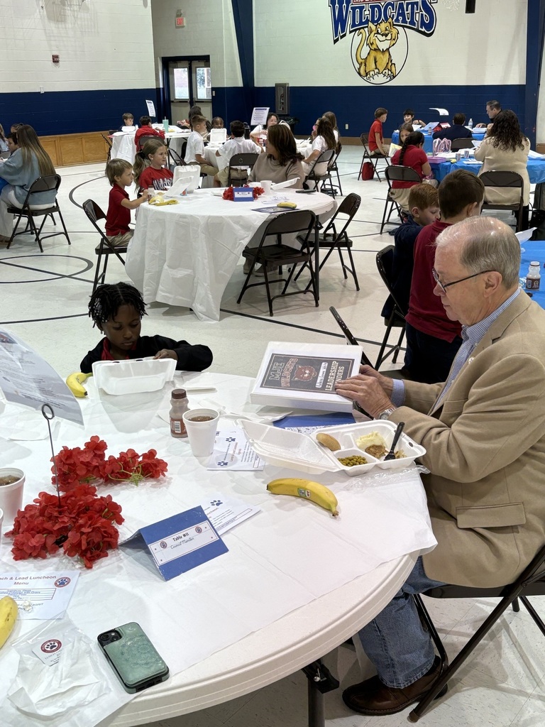 Student sharing LIM Binder with a community leader.